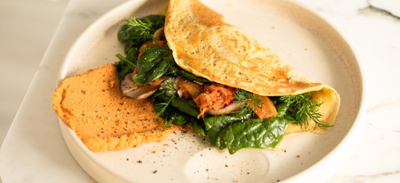 Overstuffed spinach omlete on plate